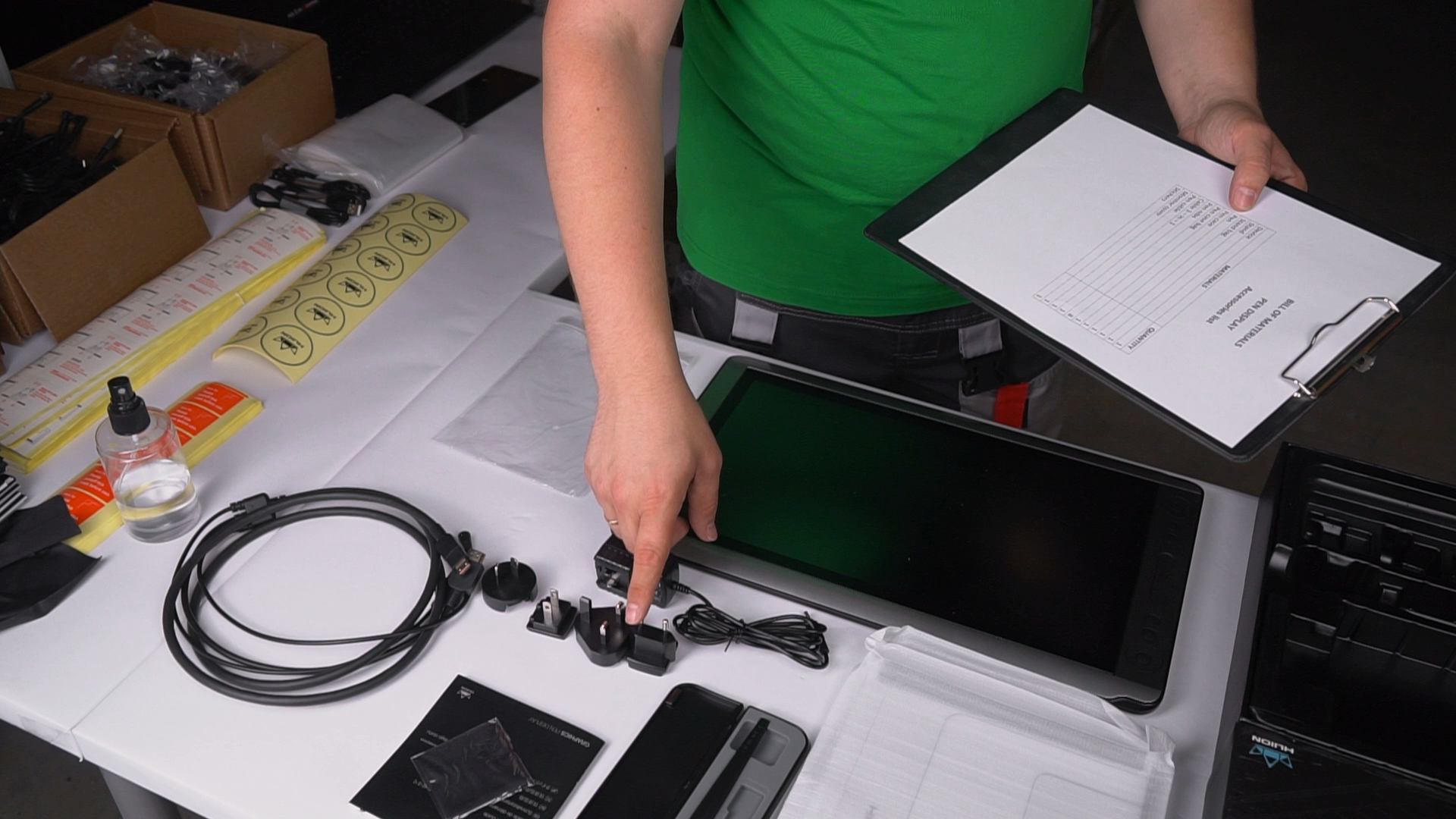 Technician checking returns against a bill-of-materials checklist